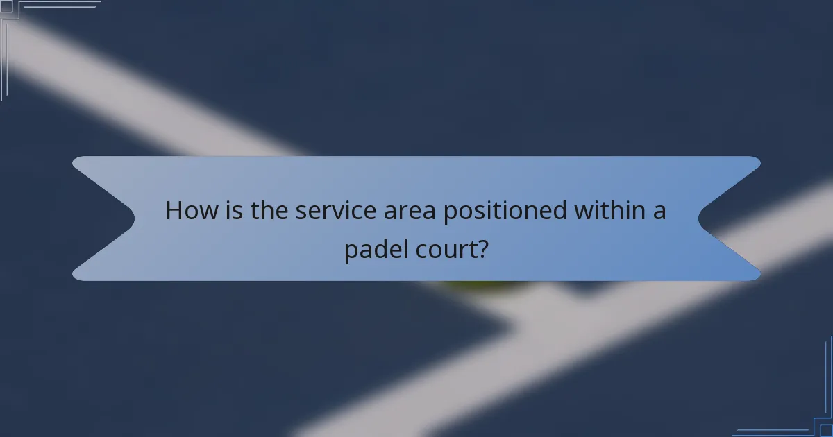 How is the service area positioned within a padel court?